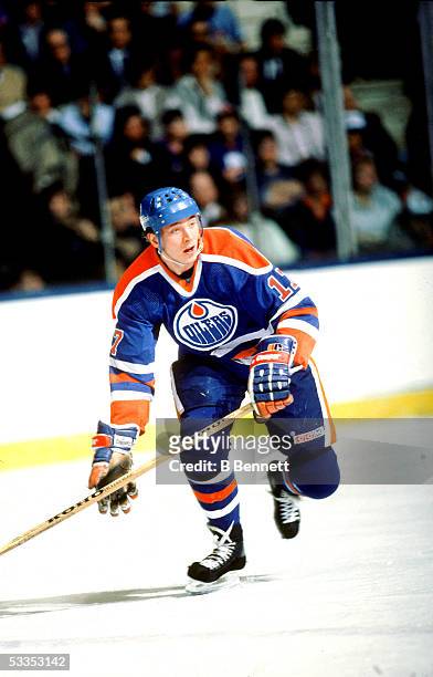 Finnish professional hockey player Jari Kurri, right wing for the Edmonton Oilers, on the ice during an away game, 1980s.
