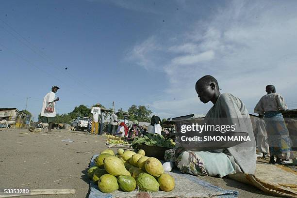 Southern Sudanese woman sells fruits in the town of Juba August, 11 August 2005. Food is so scarce in the region in this season despite the fact that...