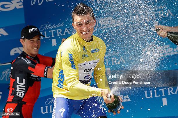 Julian Alaphilippe of France riding for Etixx - Quick-Step celebrates on the podium with champagne in the overall race leader's jersey with second...