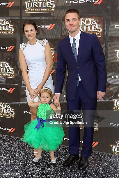 Actress Cassandra Jean , actor Stephen Amell and daughter Mavi Alexandra Jean Amell attend the "Teenage Mutant Ninja Turtles: Out Of The Shadows"...
