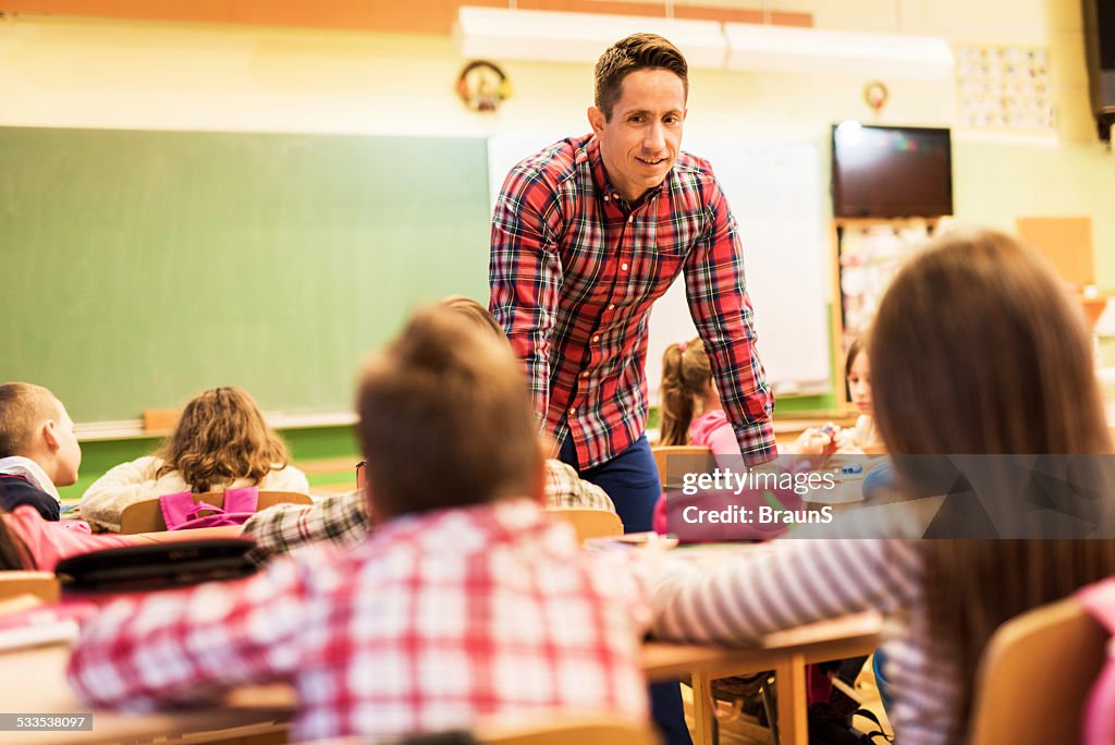 Male teacher teaching in the classroom.