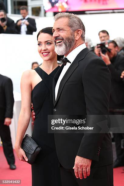 Mel Gibson and his girlfriend Rosalind Ross attend the closing ceremony of the 69th annual Cannes Film Festival at the Palais des Festivals on May...