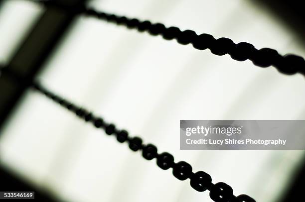 silhouette of chains. - lucy shires - fotografias e filmes do acervo