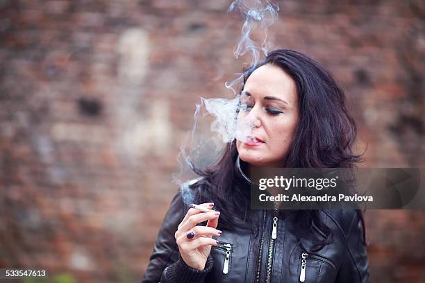 beautiful woman smoking - a person smoking stock pictures, royalty-free photos & images