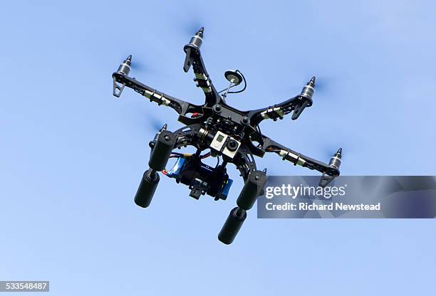 drone with camera - aerial surveillance stock pictures, royalty-free photos & images