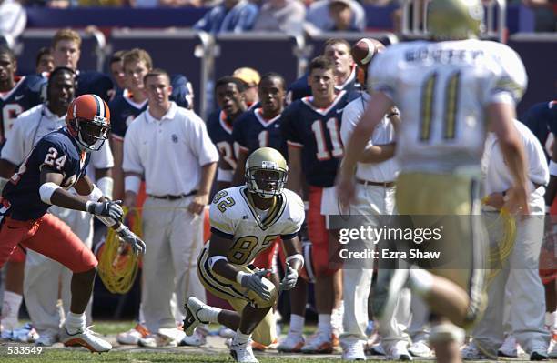 Wide receiver Jonathan Smith of Georgia Tech concentrates on the ball as cornerback Jeremiah Mason of Syracuse defends on the play. Syracuse in the...