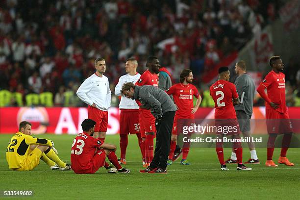 Liverpool manager Jurgen Klopp consoles Emre Can following the UEFA Europa League Final match between Liverpool and Sevilla at St. Jakob-Park on May...