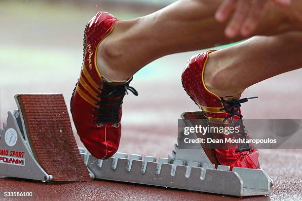 Detailed view of the adidas shoes with Pookie on the side, worn by Jeremy Wariner of the USA as he exits the starting blocks in the Mens 400m during...