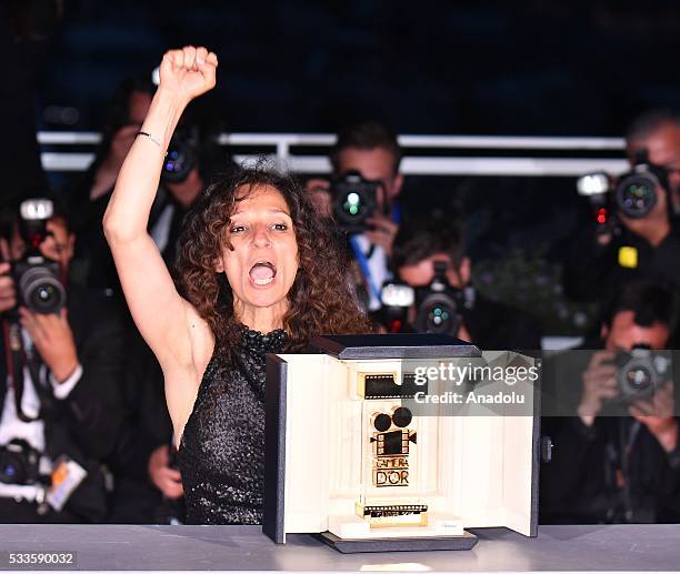 French Moroccan director Houda Benyamina poses with the Camera d'Or at the Palme D'Or Winner Photocall during the Award Winners photocall at the 69th...