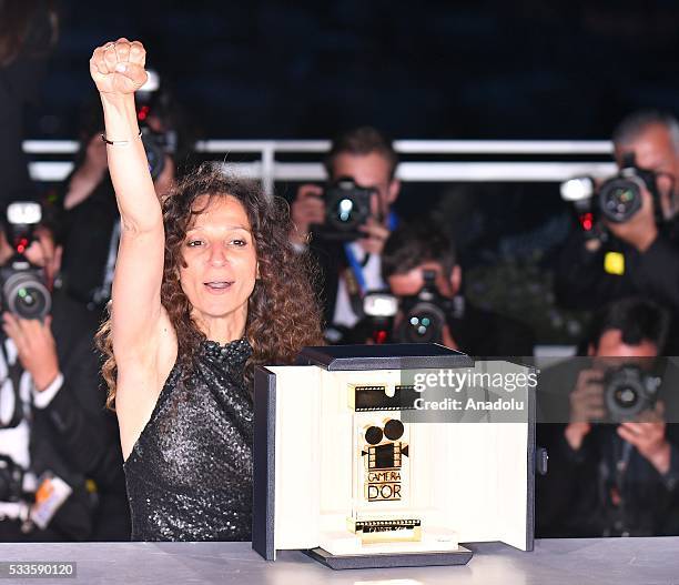 French Moroccan director Houda Benyamina poses with the Camera d'Or at the Palme D'Or Winner Photocall during the Award Winners photocall at the 69th...