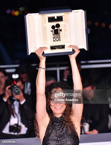 French Moroccan director Houda Benyamina poses with the Camera d'Or at the Palme D'Or Winner Photocall during the Award Winners photocall at the 69th...