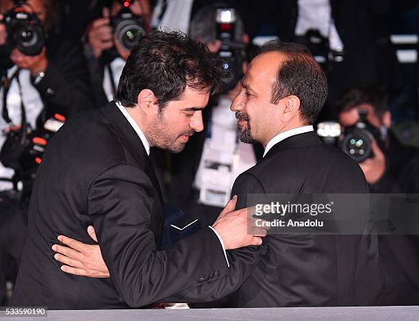 Iranian director Ashgar Farhadi and Iranian actor Shahab Hosseini pose during the Award Winners photocall at the 69th annual Cannes Film Festival on...