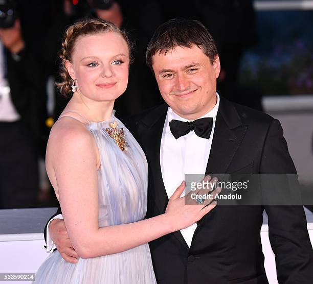 Romanian director Cristian Mungiu poses with Romanian actress Maria Dragus after he received Best Director Award for his movie 'Bacalaureat' during...
