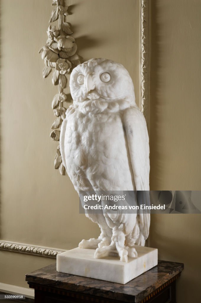 One of a pair of Athenian owl sculptures in the Staircase Hall at Wallington, Northumberland