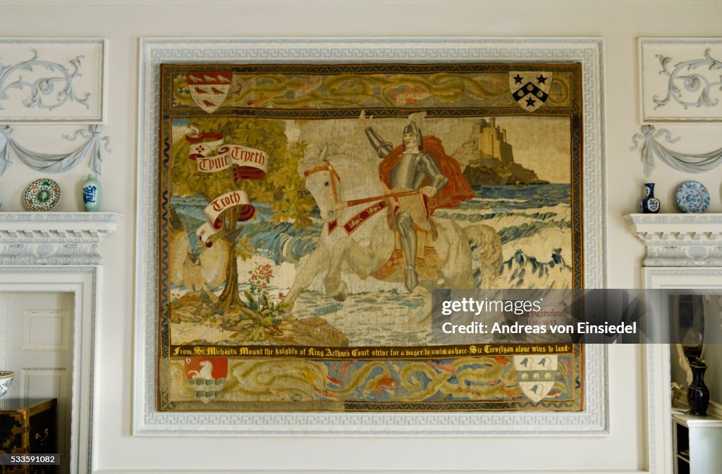 A needlework panel depicting the 'first' Trevelyan riding ashore from St Michael's Mount in Cornwall