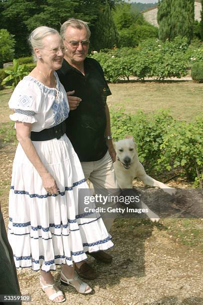 Danish Queen Margrethe II and her husband Prince Henrik pose at the annual photo call of the Royal Danish family in their summer residence at Caix on...