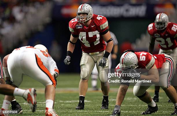 Linebacker A.J. Hawk of the Ohio State Buckeyes looks on against the Oklahoma State Cowboys during the MasterCard Alamo Bowl on December 29, 2004 at...