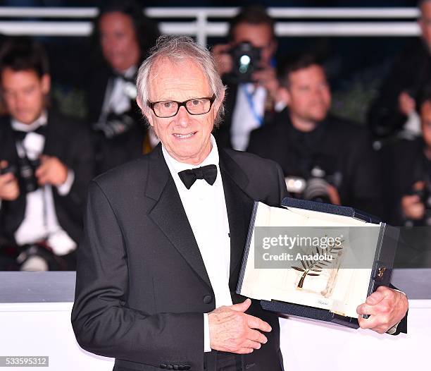 British director Ken Loach poses with the Palme d'Or for his movie 'I, Daniel Blake' during the Award Winners photocall at the 69th annual Cannes...