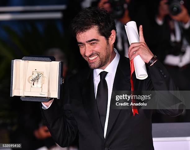 Iranian actor Shahab Hosseini poses as the Best Performance by an Actor award for 'Forushande' during the Award Winners photocall at the 69th annual...