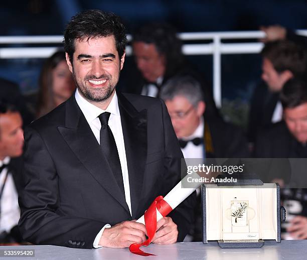 Iranian actor Shahab Hosseini poses as the Best Performance by an Actor award for 'Forushande' during the Award Winners photocall at the 69th annual...