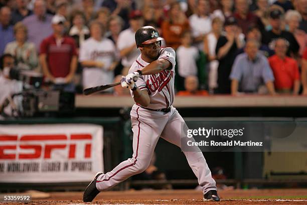 Outfielder Andruw Jones of the Atlanta Braves swings at a Houston Astros pitch during game three of the National League Division Series on October 9,...