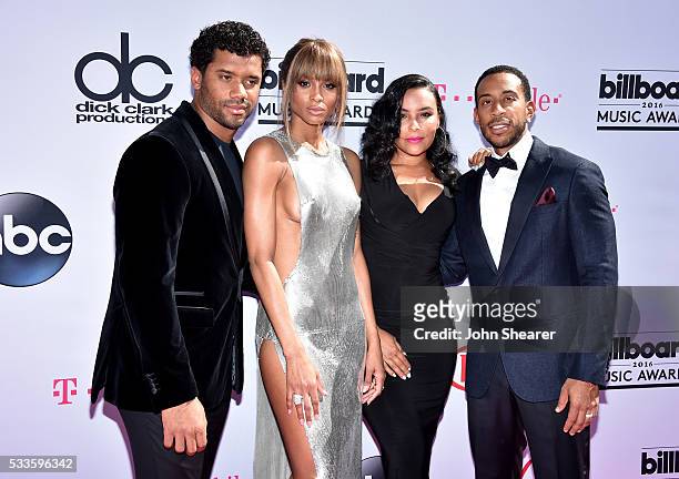 Professional football player Russell Wilson, singer Ciara, model Eudoxie Mbouguiengue, and Ludacris attend the 2016 Billboard Music Awards at...