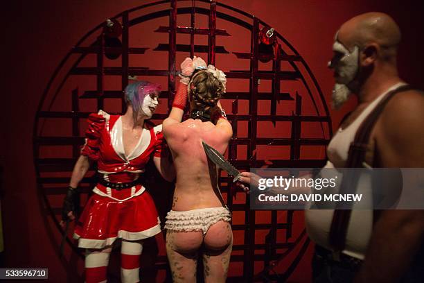 Clown dominatrix Dutchess and Matlock dominate voluntary submissive Hello Kitty at a dungeon party during the DomCon LA domination convention on May...