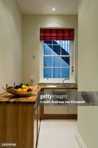 belgravia townhouse - narrow kitchen stock pictures, royalty-free photos & images