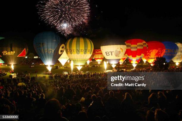 Hot air balloons are seen at the night glow on the opening day of the Discovery Channel International Balloon Fiesta on August 11, 2005 in Bristol,...
