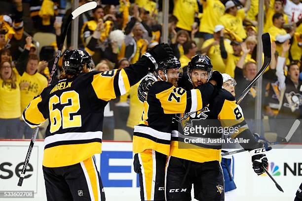 Patric Hornqvist of the Pittsburgh Penguins celebrates with Sidney Crosby and Carl Hagelin after scoring a goal on Andrei Vasilevskiy of the Tampa...