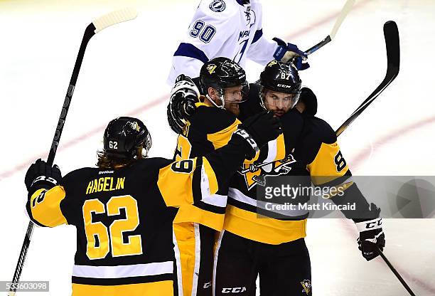 Patric Hornqvist of the Pittsburgh Penguins celebrates with Sidney Crosby and Carl Hagelin after scoring a goal on Andrei Vasilevskiy of the Tampa...