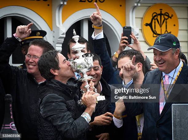 Exaggerator trainer Keith Desormeaux kisses the Woodlawn Vase after the horse won the 141st Preakness Stakes on Saturday, May 21 at Pimlico Race...