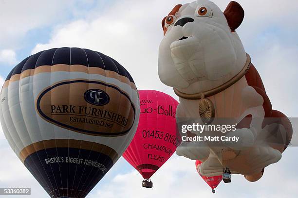 Hot air balloons fill the sky at the early morning mass balloon ascent, kicking off the second day of the Discovery Channel International Balloon...