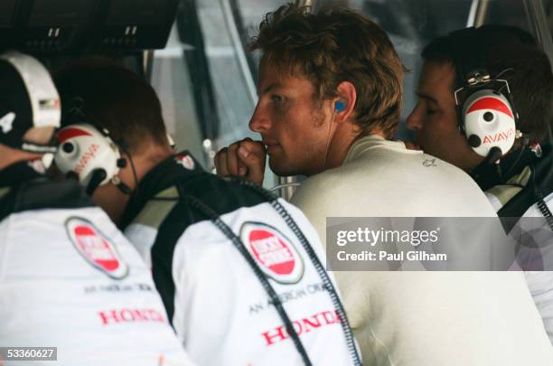 Jenson Button of England and B.A.R. - Honda on the team pitwall during the practice session for the Hungarian F1 Grand Prix at the Hungaroring on...