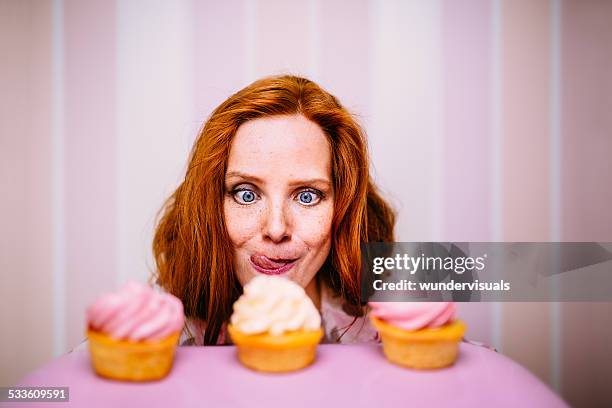 young woman really wants to eat cupcakes - tårta bildbanksfoton och bilder