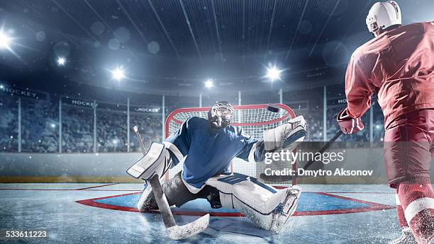 ice hockey players in action - hockey goalie stockfoto's en -beelden