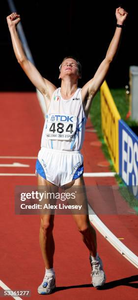 Alex Schwazer of Italy celebrates after he finished third in the men's 50 Kilometres Race Walk final at the 10th IAAF World Athletics Championships...