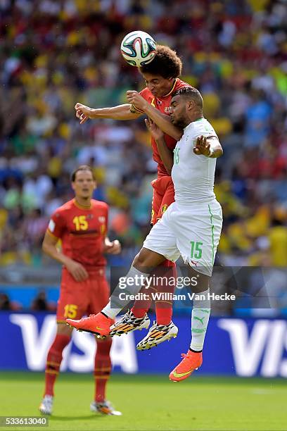 Axel Witsel of Belgium classes heads with El Arbi Hillel Soudani of Algeria during a FIFA 2014 World Cup Group H match between Belgium and Algeria at...