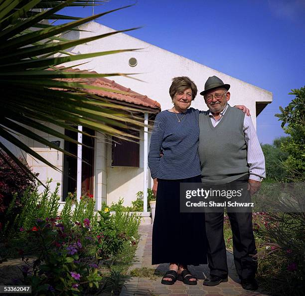 Yhoda Gross and Miryam Gross stand in front of the house they have lived in for the past 18 years June 12, 2005 in the Neve Dekalim settlement in...