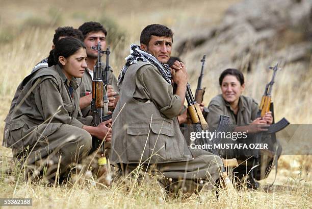 Guerrilla fighters of the PKK listen to instructions from their team commander during a training session in a camp near Arbil in the Haqourqi...