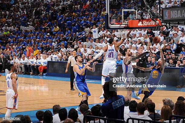 Stephen Curry of the Golden State Warriors shoots against Steven Adams of the Oklahoma City Thunder in Game Three of the Western Conference Finals...