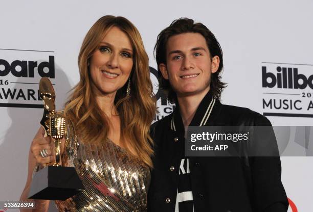 Honoree Celine Dion , recipient of the Icon Award, and Rene-Charles Angelil pose in the Photo Room during the 2016 Billboard Music Awards at the...