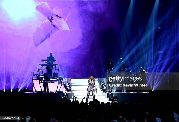 Recording artist Madonna performs a tribute to Prince onstage during the 2016 Billboard Music Awards at T-Mobile Arena on May 22, 2016 in Las Vegas,...