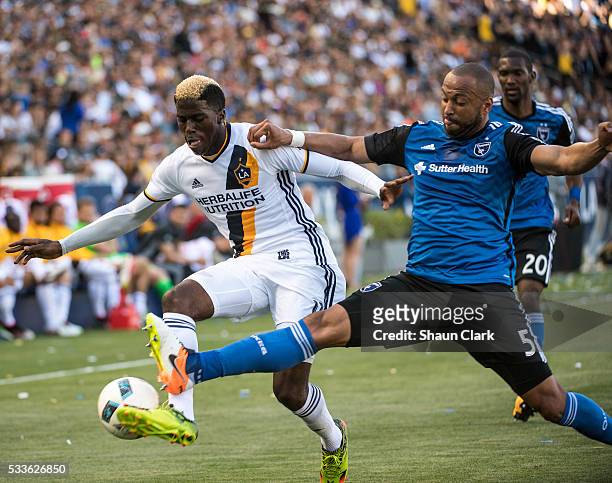 Gyasi Zerdes of Los Angeles Galaxy battles Victor Bernardez of San Jose Earthquakes during Los Angeles Galaxy's MLS match against San Jose...