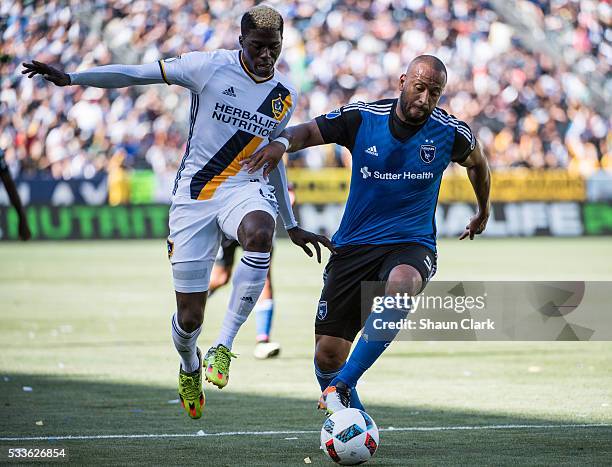 Gyasi Zerdes of Los Angeles Galaxy battles Victor Bernardez of San Jose Earthquakes during Los Angeles Galaxy's MLS match against San Jose...