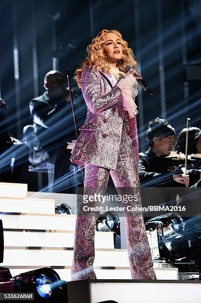 Recording artist Madonna performs a tribute to Prince onstage during the 2016 Billboard Music Awards at T-Mobile Arena on May 22, 2016 in Las Vegas,...