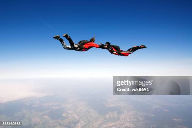 freefall - couple airplane stock pictures, royalty-free photos & images