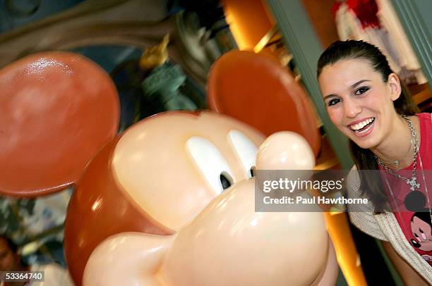Actress Christy Carlson Romano poses with a 75th Anniversary Mickey Mouse designed by Carlson Romano depicting her alter ego "Kim Possible" as she...