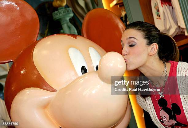 Actress Christy Carlson Romano kisses a 75th Anniversary Mickey Mouse designed by Carlson Romano depicting her alter ego "Kim Possible" as she visits...