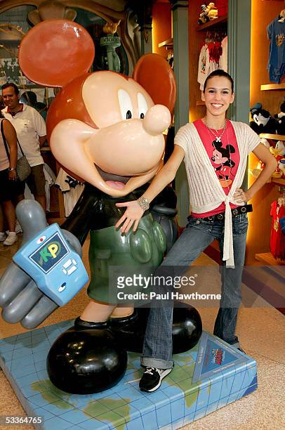 Actress Christy Carlson Romano poses with a 75th Anniversary Mickey Mouse designed by Carlson Romano depicting her alter ego "Kim Possible" as she...